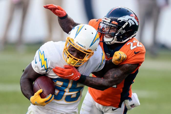Chargers running back Troymaine Pope (35) is tackled by Denver Broncos safety Kareem Jackson (22). Mandatory Credit: Isaiah J. Downing-USA TODAY Sports